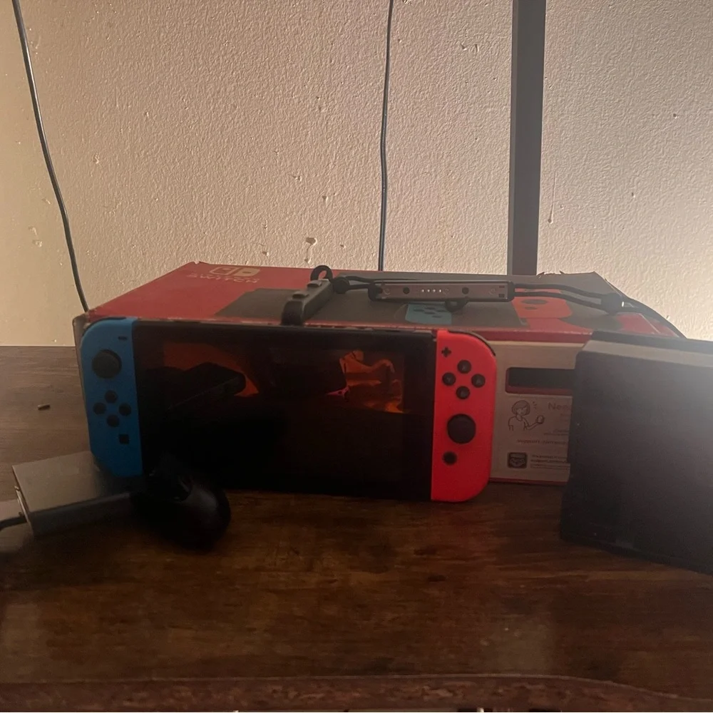 Nintendo Switch Console with Red and Blue Controllers